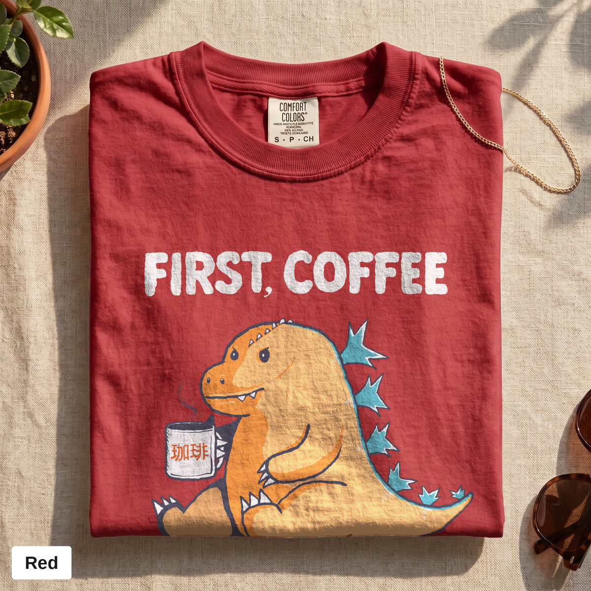 First Coffee dinosaur graphic tee, Comfort Colors 1717 in Red, folded flat lay