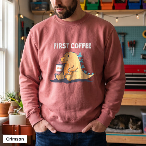 Crimson Comfort Colors crewneck sweatshirt worn by a man, First Coffee kaiju design printed on the chest