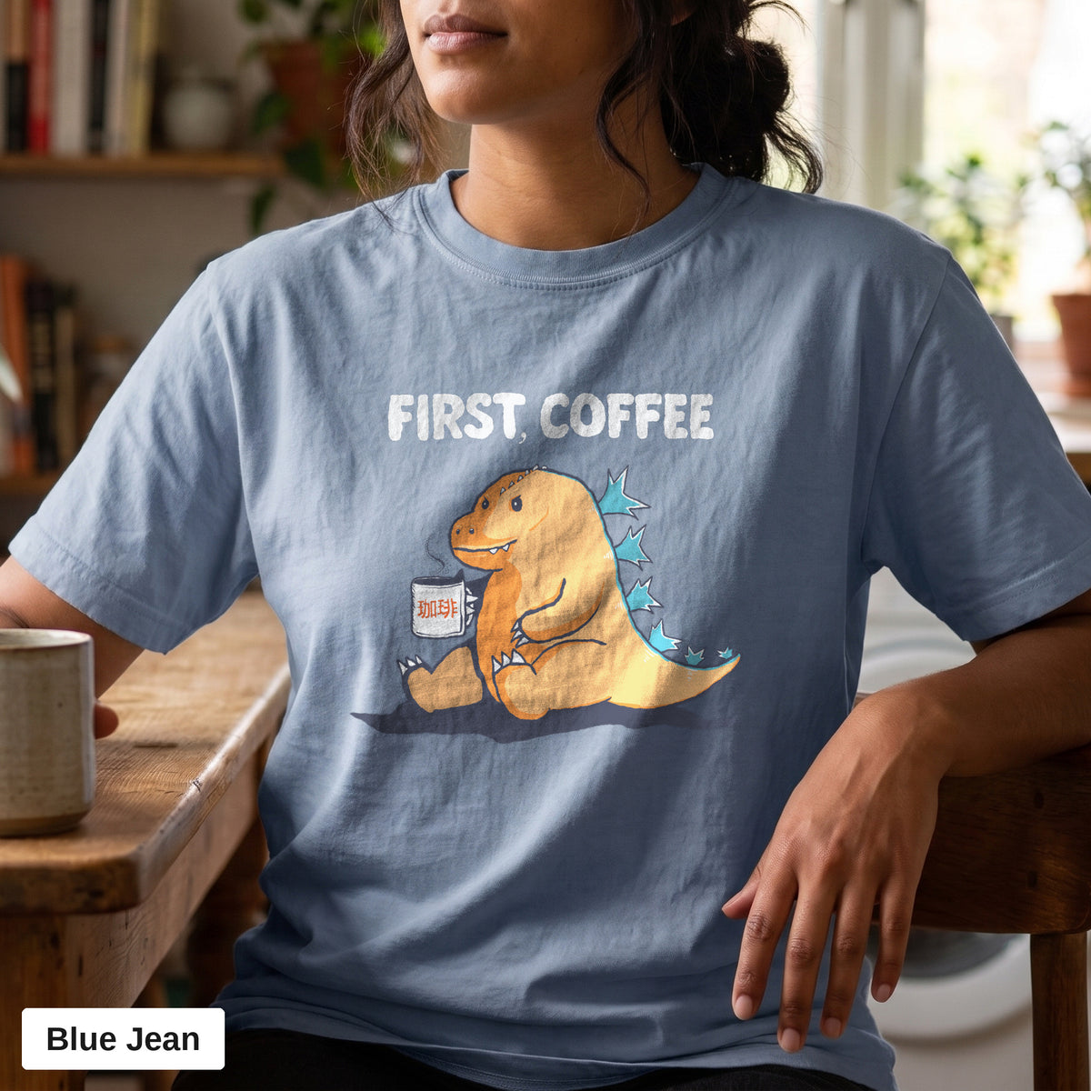 First Coffee dinosaur graphic tee, Comfort Colors 1717 in Blue Jean, worn