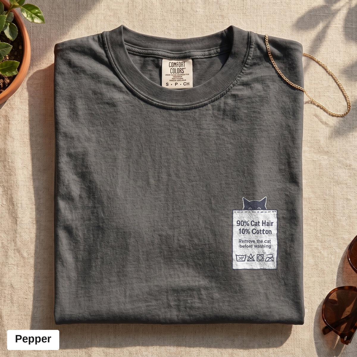 90% Cat Hair 10% Cotton pocket print tee, Comfort Colors 1717 in Pepper, folded flat lay