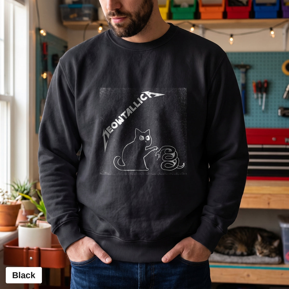 Black Comfort Colors crewneck sweatshirt worn by a man, metal cat and snake design printed on the chest