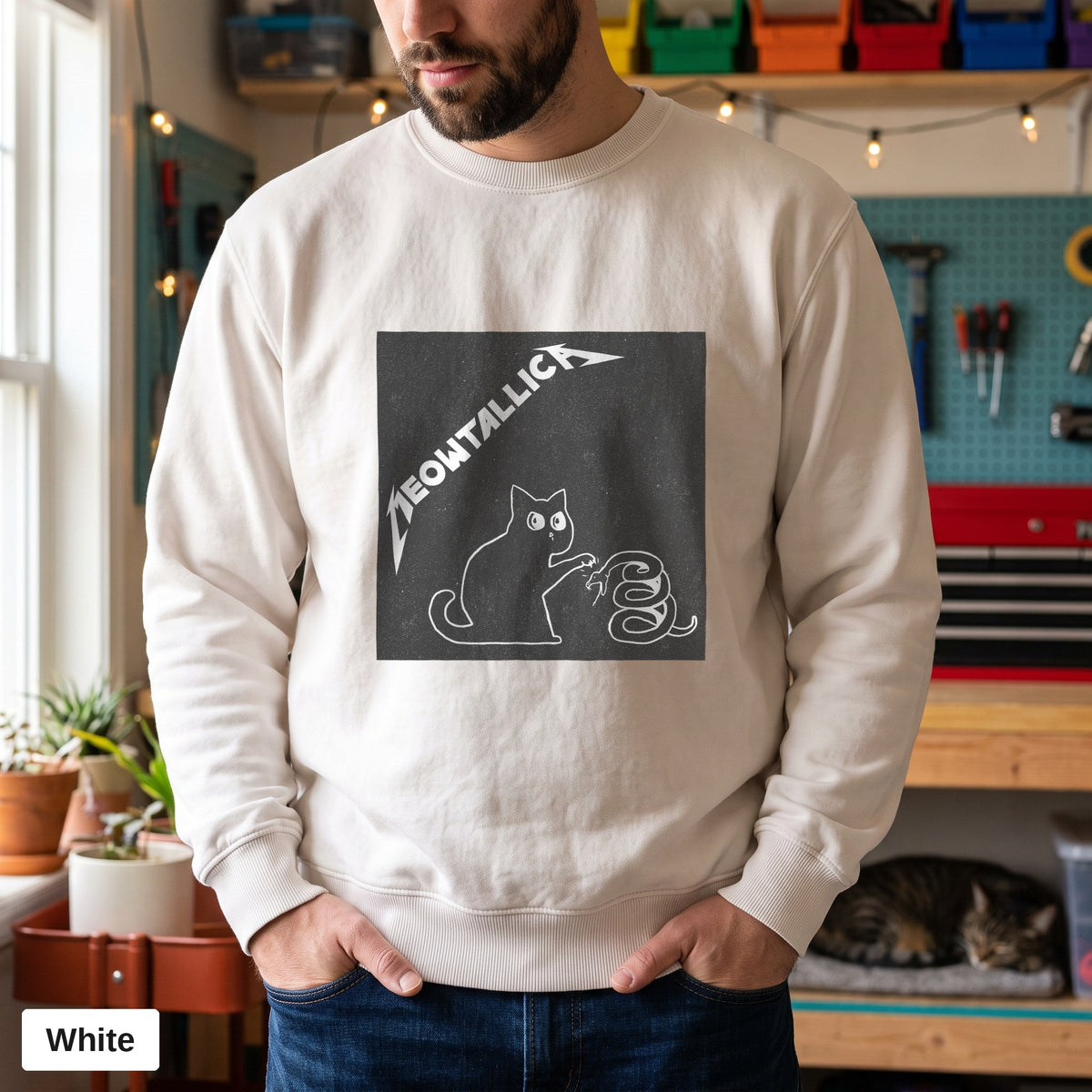 White Comfort Colors crewneck sweatshirt worn by a man, metal cat and snake design printed on the chest