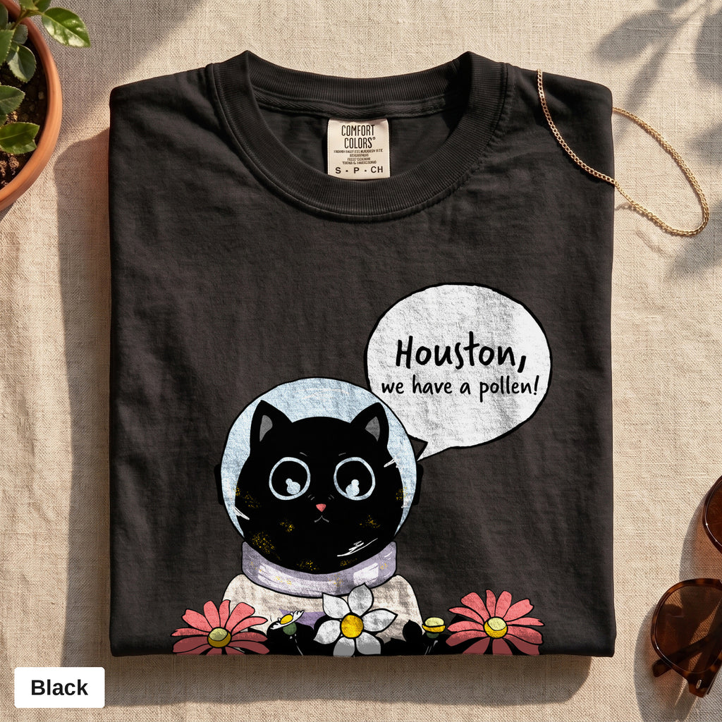 Houston We Have A Pollen cat astronaut tee, Comfort Colors 1717 in Black, folded flat lay