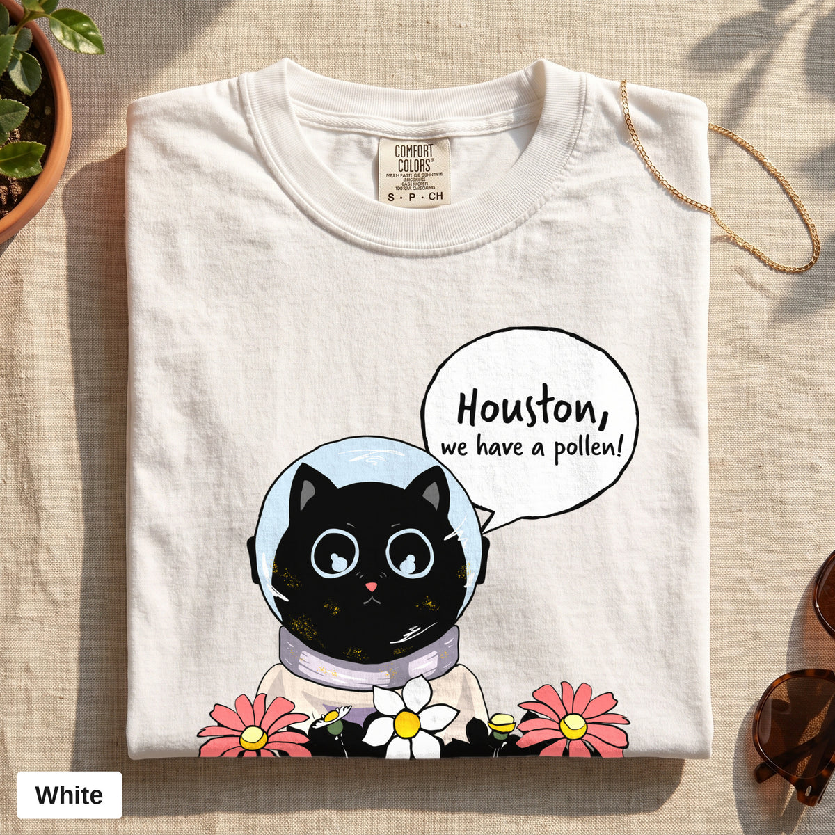 Houston We Have A Pollen cat astronaut tee, Comfort Colors 1717 in White, folded flat lay