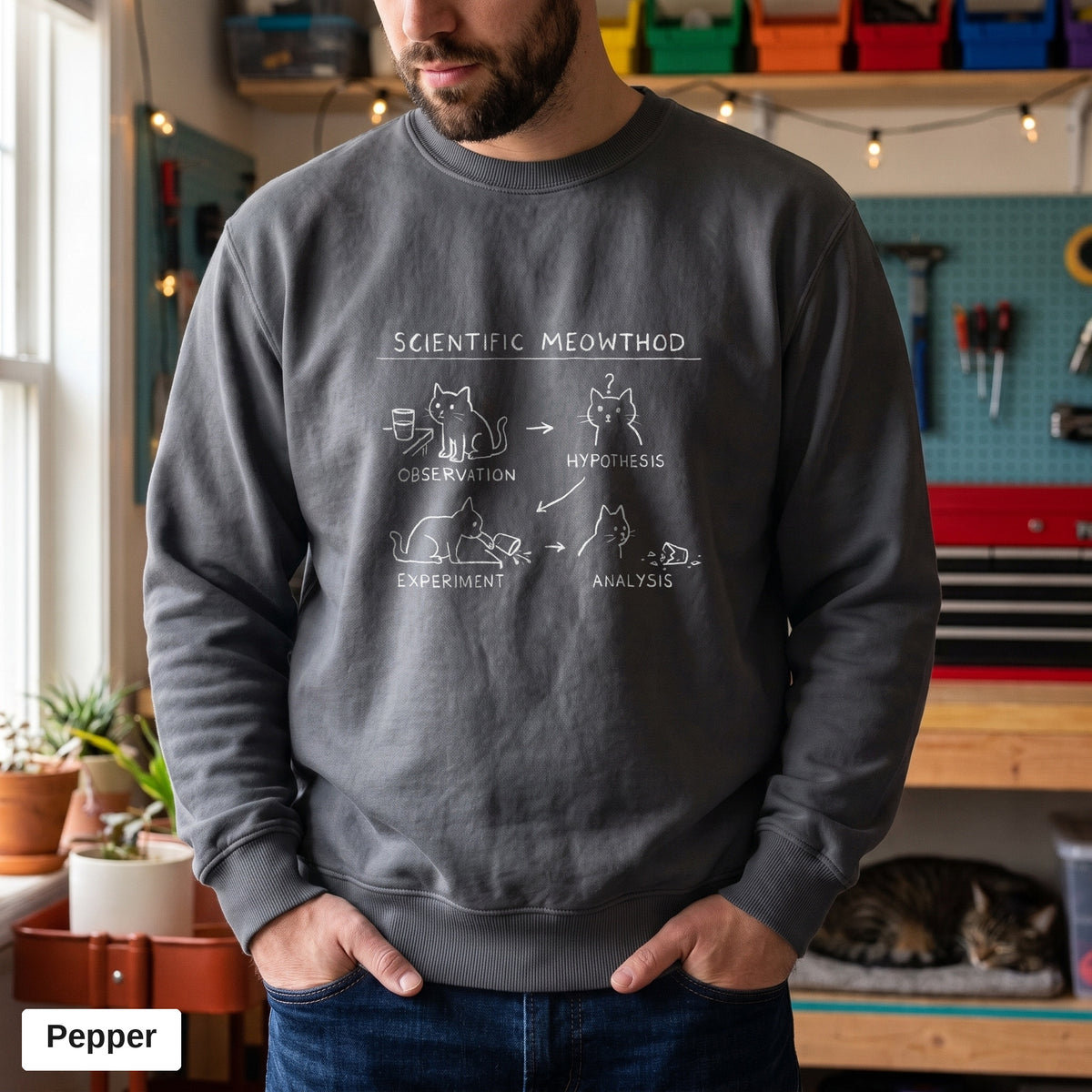 Pepper Comfort Colors crewneck sweatshirt worn by a man, Scientific Meowthod cat science diagram printed on the chest