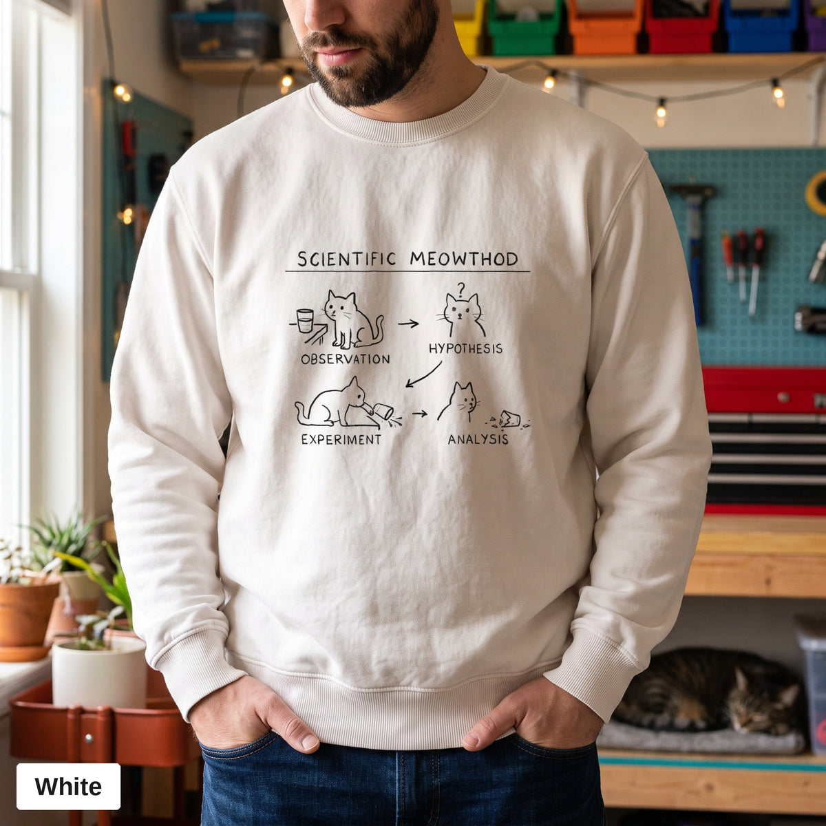 White Comfort Colors crewneck sweatshirt worn by a man, Scientific Meowthod cat science diagram printed on the chest