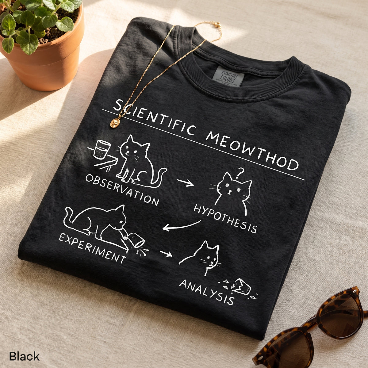 Scientific Meowthod Comfort Colors t-shirt folded flat lay in Black