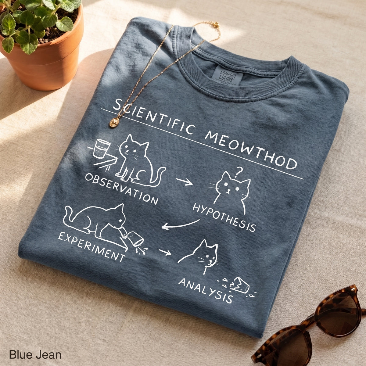 Scientific Meowthod Comfort Colors t-shirt folded flat lay in Blue Jean