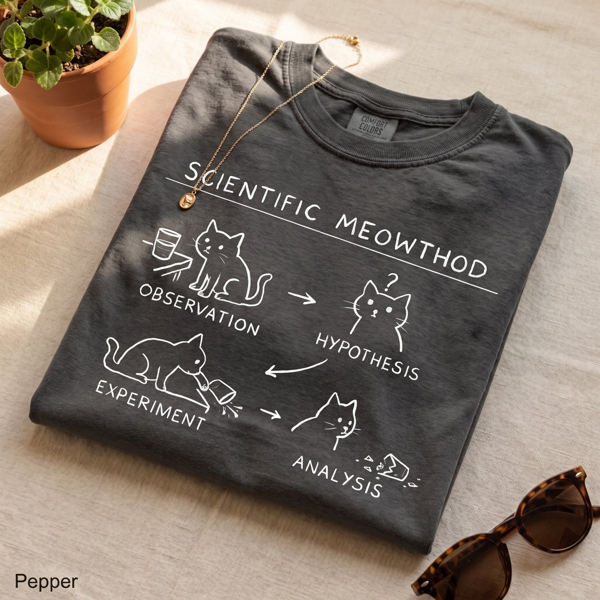 Scientific Meowthod Comfort Colors t-shirt folded flat lay in Pepper