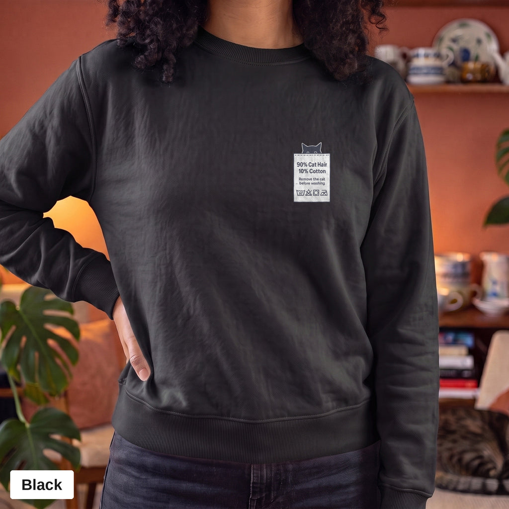 Black Comfort Colors crewneck sweatshirt worn by a model, 90% Cat Hair 10% Cotton design printed on the chest