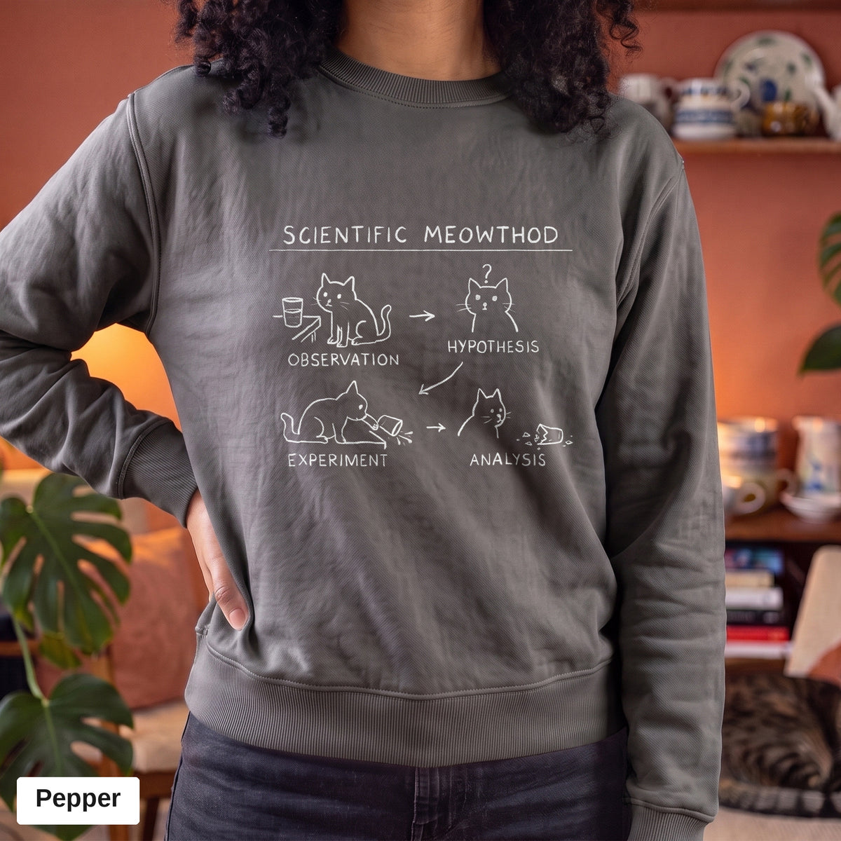 Pepper Comfort Colors crewneck sweatshirt worn by a model, Scientific Meowthod cat science diagram printed on the chest